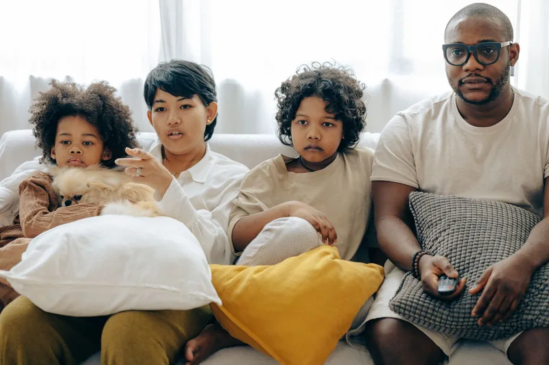 A family together on the sofa