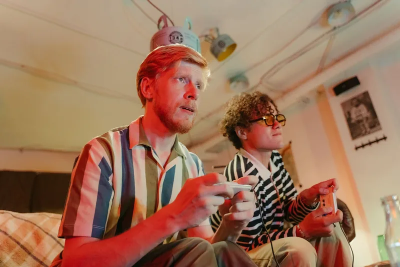 Two people playing a game together at home
